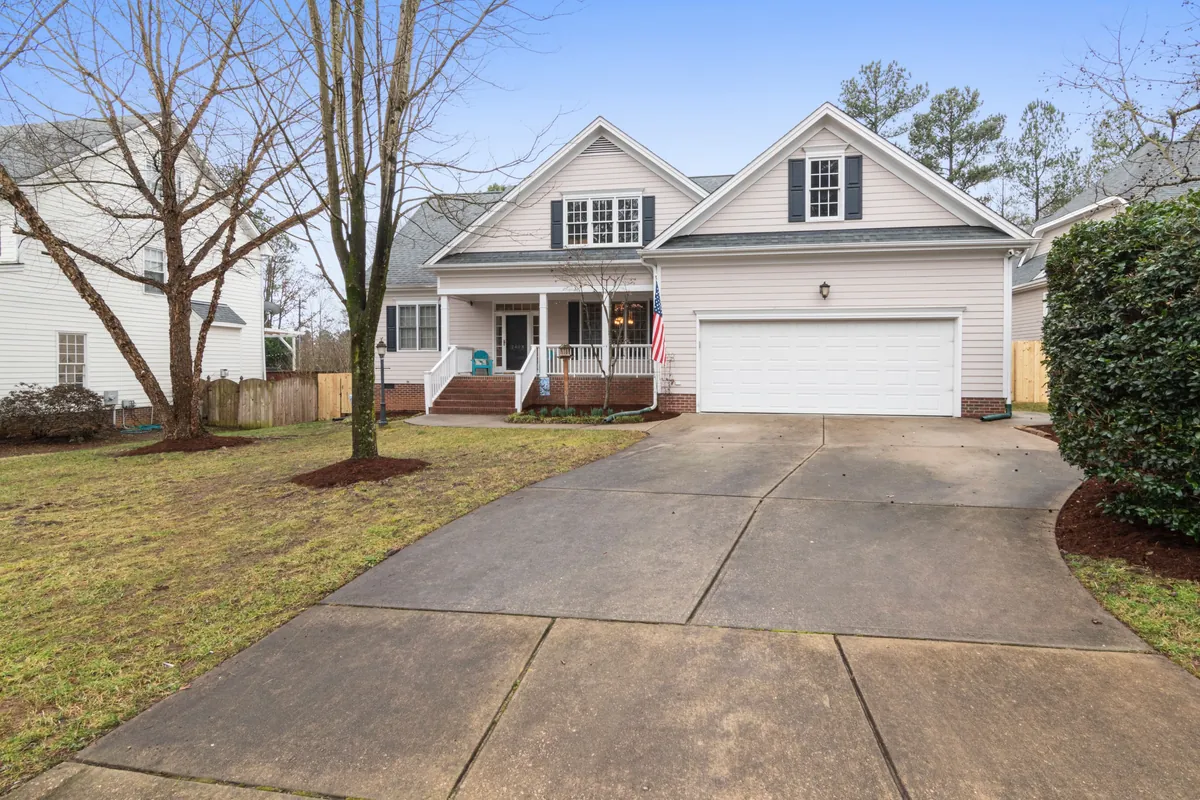 Suburban home with a wide concrete driveway and clean control joints